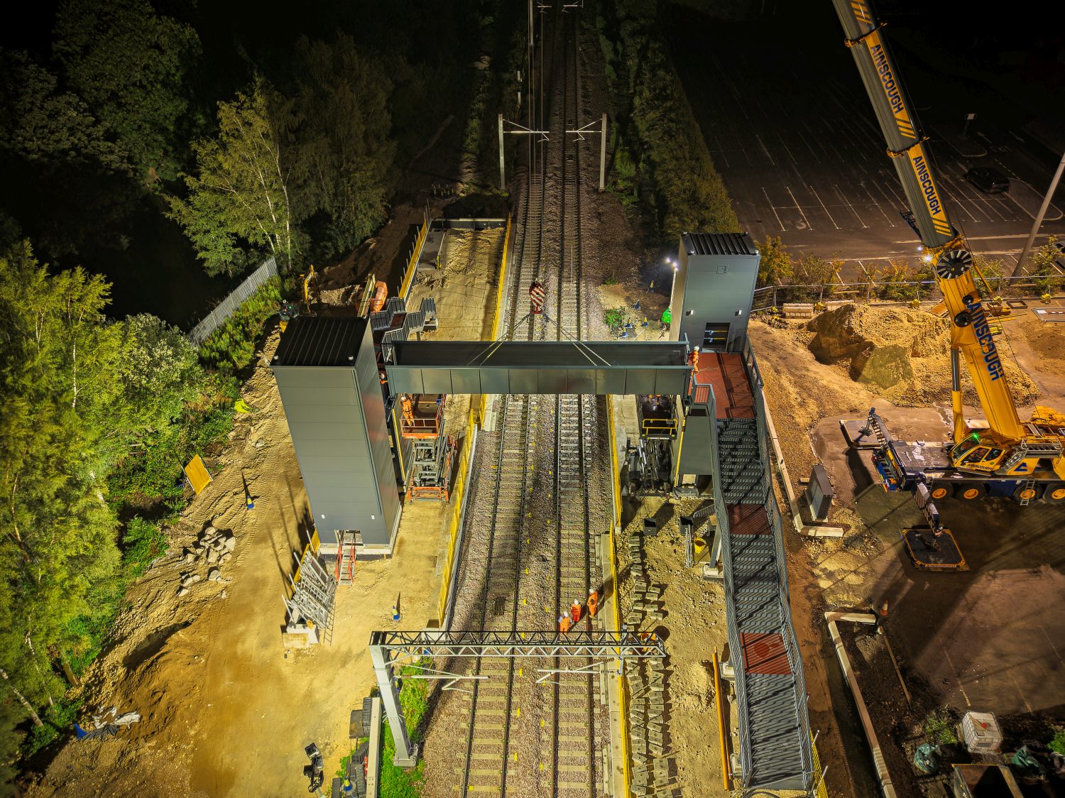 Night-time aerial view of the Magna Power Station railway lift and bridge installation, Amco Giffen, photographed by McFade Photography